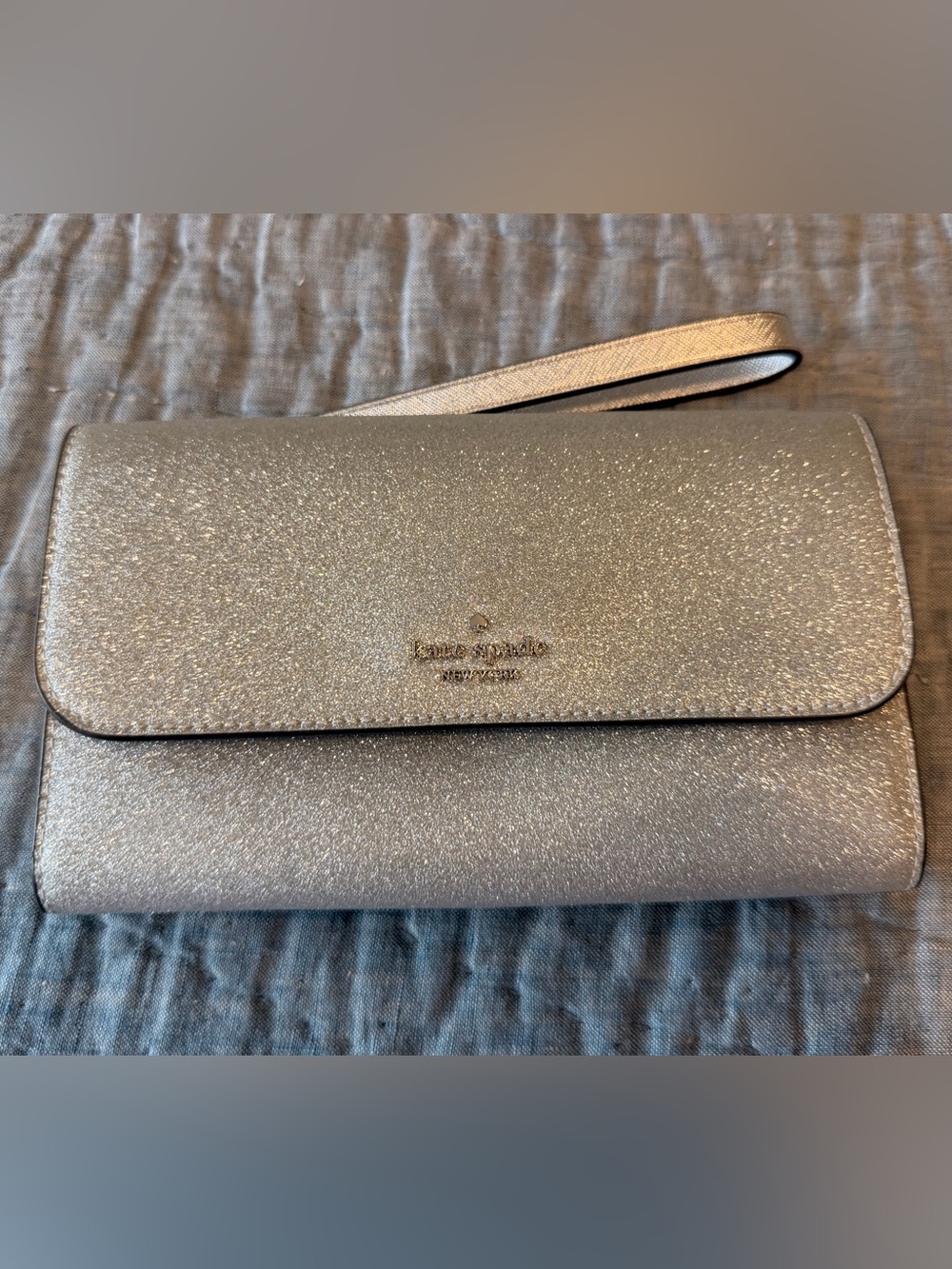 kate spade silver glitter fold-over wristlet clutch
